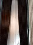 A picture of Curtains and rode 