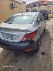 A picture of 2013 HYUNDAI ACIENT FIRST BODY SUPER GLEAN engine and gear