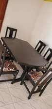 A picture of Dinning table with adh fridge both for sell at 800k