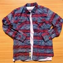 A picture of Original flannel shirts available Call whatsapp 0759636169 Inbox for orders
