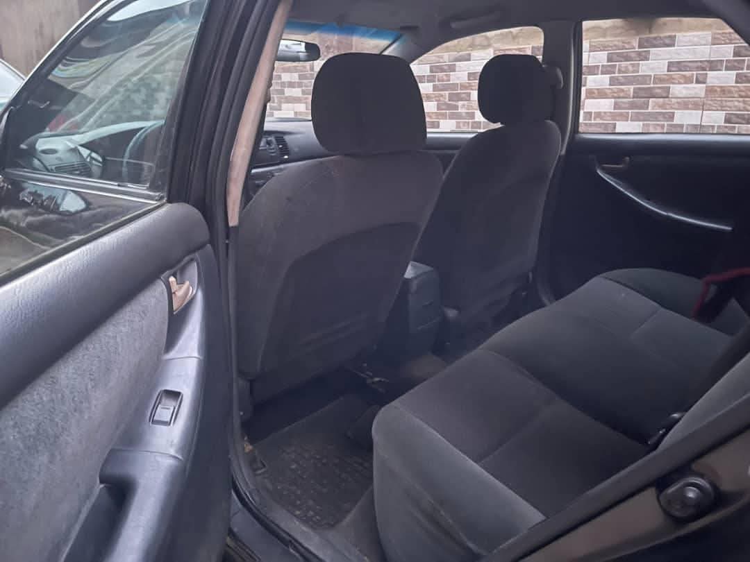 A picture of Toyota Corolla 2004 sport Painted once Engine gear and ac