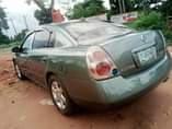 A picture of Nissan Altima engine ac cool gear perfect location 0werri 07040637386