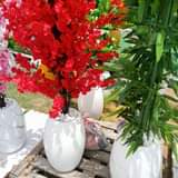 A picture of Flower vase and Artificial flowers