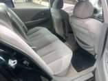A picture of Nissan altima in good condition 4cylinder everything is working first