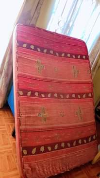 A picture of Curtains suitcase fan and mattress