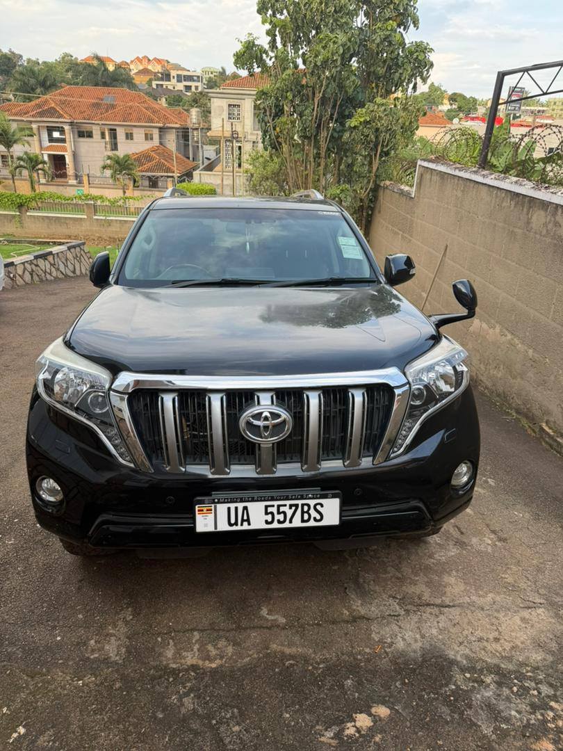 A picture of Chinese client leaving Uganda selling 8 months old Prado Tx