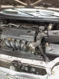 A picture of Toyota Corolla 2004 Gold very neat