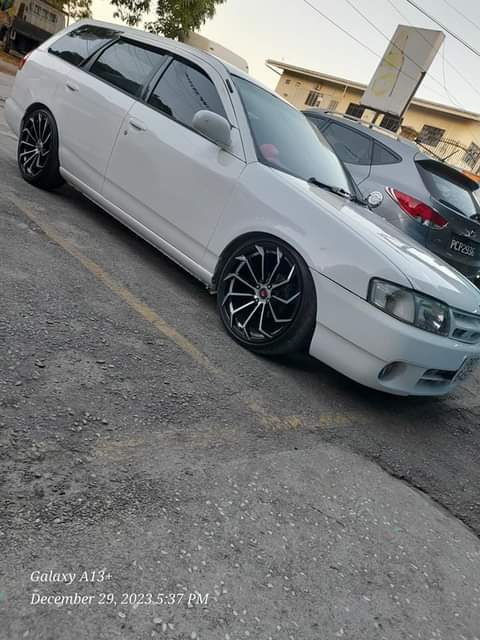 Trini- B.