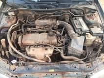 A picture of Mazda 323f Working fine with little smoking Price 600k Location