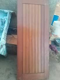 A picture of 6 mahogany and one aluminium door