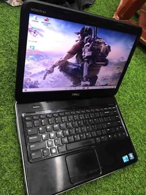 A picture of Dell vostro 1440core i3 imenyooka kila kitu lipia TSH 245