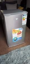 A picture of Dinning table with adh fridge both for sell at 800k