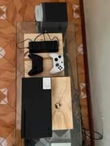 A picture of XBOX SERIES X. 12 latest games installed