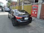 A picture of NIGERIAN USED TOYOTA COROLLA 2014 FACELIFTED TO 2018 PARTLY PAINTED
