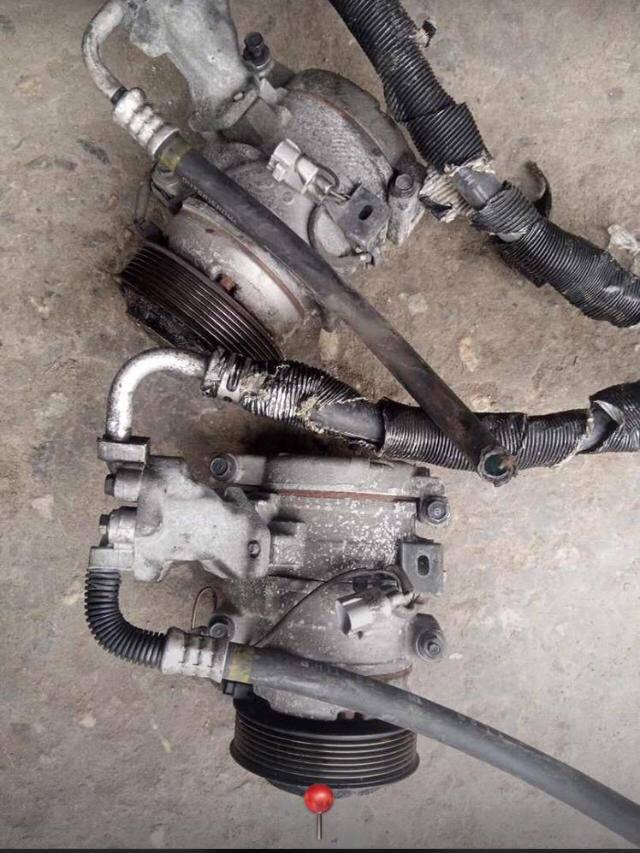 A picture of Car AC compressor condenser and evaporator