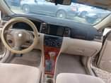 A picture of GOLD SUPER SHARP COROLLA 2006 IN A STANDARD GRADE AC