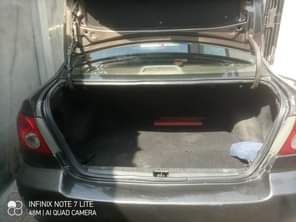 A picture of TOYOTA COROLLA 2004 MODEL WITH SHARPEST INTERIOR AND INDOMIE RIMS
