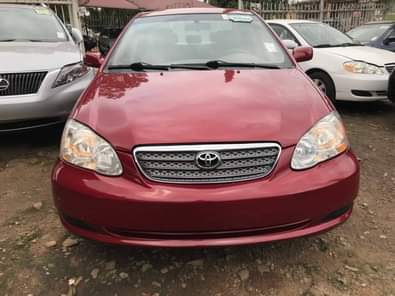 A picture of Features 2005 Wine Corolla CE 1 8l i4 engine Automatic