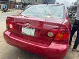 A picture of Sharp 2004 Toyota Corolla with sound engine and gear AC