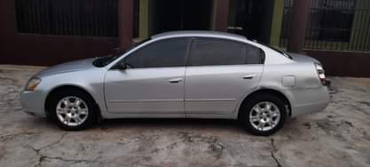 A picture of DELAY IS DANGEROUS 2004 NISSAN ALTIMA Painted on first body