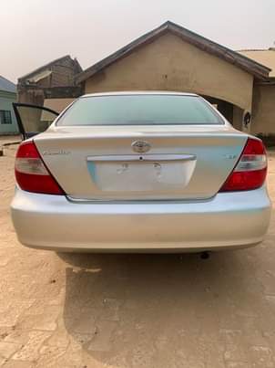 A picture of FIRST BODY UNREGISTERED UNTEMPERED ENGINE 2004 TOYOTA CAMRY IN A