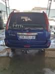 A picture of Nissan xtrail 2.0 2006 model driving perfectly full house big