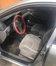 A picture of Clean Nigerian Used Silver Toyota Corolla 2003 Repainted Fabric interior