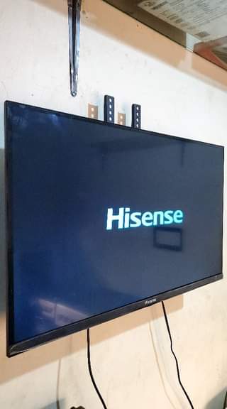A picture of Hisense tv frameless 32 inches and changhong fridge 120 litres