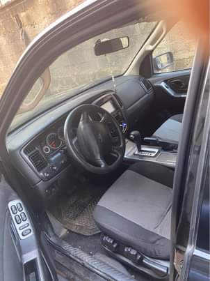 A picture of Ford Escape 2010 Japanese specs four plugs very very low