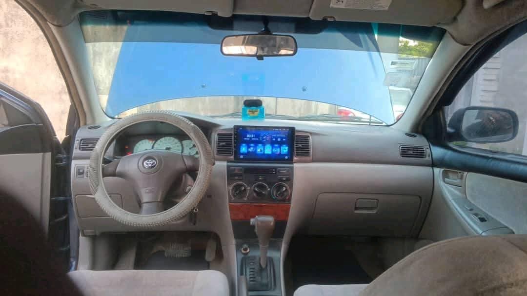 A picture of Toyota Corolla 2003. Painted. Engine gear and ac are working