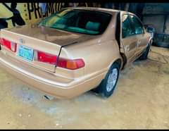 A picture of TOYOTA CAMRY TINY BIG ENGINE GEAR AC BODY OKAY PRICE