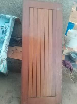 A picture of 6 mahogany and one aluminium door