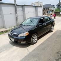 A picture of Must Go Today Sharp Black 2004 Toyota Corolla first body