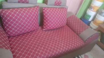 A picture of kitanda na godoro lake 80k sofa la wawawili 70k .