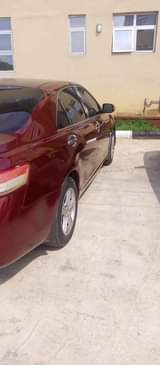 A picture of Toyota Camry 2010 model with chilling AC everything working Uyo