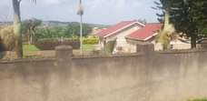 A picture of Land with houses inside