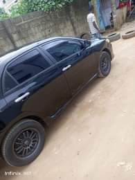 A picture of Toyota corolla nigeria used 2009 molde ac everything is working