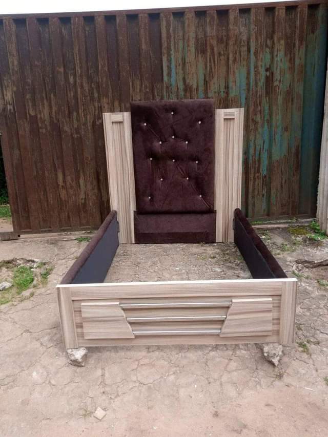 A picture of Bed frame Furniture upholstery wit brown fabric material HDF wood