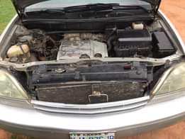 A picture of Lexus Rx300 2002 Baked on first body pan Neatly used