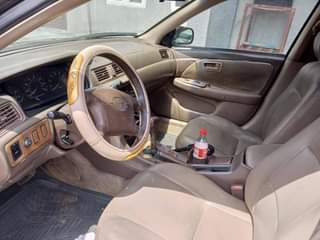 A picture of Toyota Camry tiny light with clean engine gear and AC