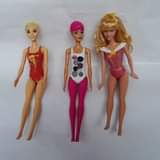 A picture of Barbie dolls