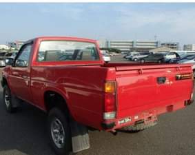 A picture of 1990 NISSAN DATSUN PICKUP THE VEHICLE PRICE IS 650 000