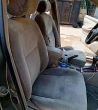 A picture of Clean Nigerian Used Grey Toyota Corolla 2003 Repainted Fabric interior