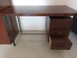 A picture of Wooden office desk table with three drawers
