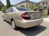 A picture of 2004 Camry with v6 Engine Leather interior Open roof Chilling