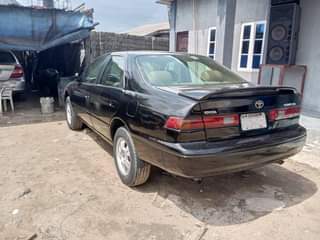 A picture of Toyota Camry tiny light with clean engine gear and AC