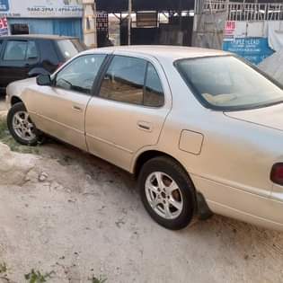A picture of Toyota Camry orobo pure first body engine and gear perfect