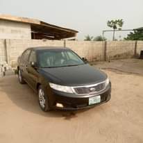 A picture of Clean Kia optima 2010 model For give away price Going
