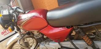 A picture of Bajaj for sale is good for bussines money needed urgently