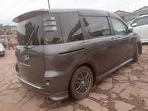 A picture of 18 toyota sienta model 2008 9 price tag.. 26.5m ugx